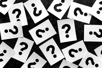 Bold black question marks on paper cards