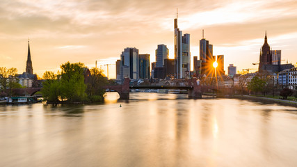 Fototapeta premium Frankfurt skyline and Main river at sunset
