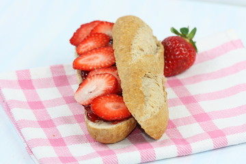 Sandwiches with jam and strawberries.