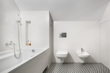 White bathroom with bathtub