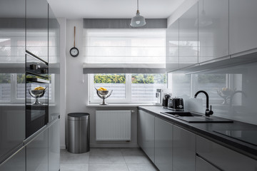 Interior of modern designed kitchen with window