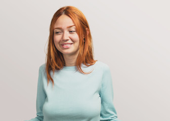 portrait of a pretty redhead girl laughing