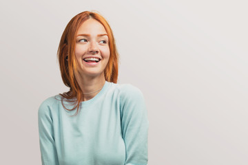 Obraz premium portrait of a pretty redhead girl looking at side