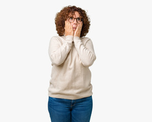 Beautiful middle ager senior woman wearing turtleneck sweater and glasses over isolated background Tired hands covering face, depression and sadness, upset and irritated for problem