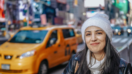 Young beautiful woman in the streets of New York for sightseeing