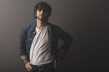 Fototapeta premium Young caucasian rock an roll man expressing emotions