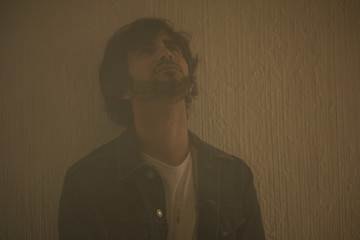 Young caucasian rock an roll man expressing emotions