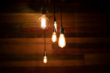 Close up many yellow lamp in cafe at night