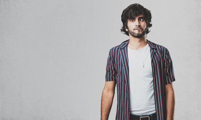 Young handsome man crazy and desperate, screaming out of control, funny lunatic expressing freedom and wild