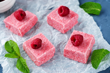 Raspberry coconut butter Fudge with fresh raspberries and mint leaves