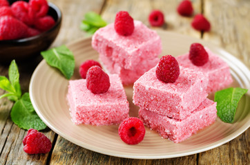 Raspberry coconut butter Fudge with fresh raspberries and mint leaves