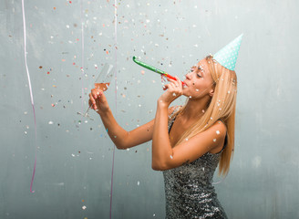 Portrait of young elegant blonde woman celebrating a party.
