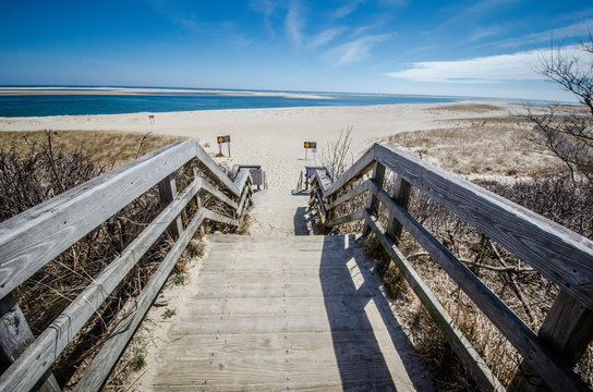 Stairs leading down to the sandy beach along Cape Cod National Seashore