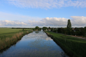 Canal de la Haute-Seine. Abandoned canal in central, northeastern France. Clesles, Champagne, Marne, Grand Est, France. Warm, calm, pleasant, spring day. Fresh, green vegetation. Growing plants.