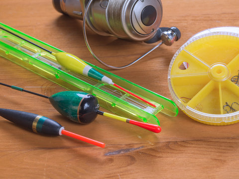 Tackles for summer fishing - floats, round yellow boxes, fish hooks