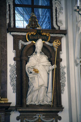 Statue of Saint Boniface on the altar in Saint Benedict basilica in the famous Benediktbeuern abbey, Germany 