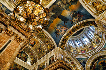Fototapeta na wymiar Icons and decorated dome with windows in the interior of the St Isaac Cathedral in St Petersburg, Russia