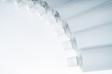 Close up of aluminum tube isolated on white background. Cosmetic or medicine gel.