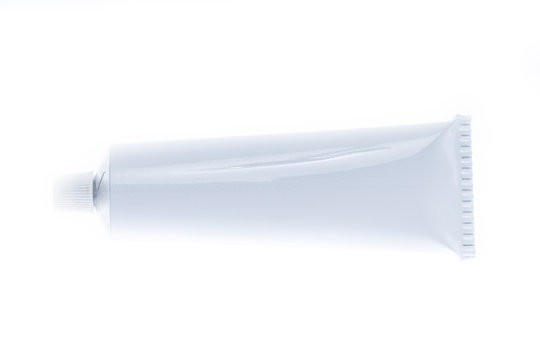Close up of aluminum tube isolated on white background. Cosmetic or medicine gel.