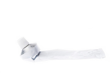 Close up of aluminum tube isolated on white background. Cosmetic or medicine gel.