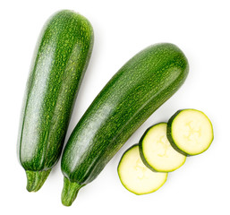 Ripe zucchini and sliced slices on a white. The form of the top.