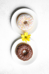 Donuts in chocolate and icing. International Women's Day
