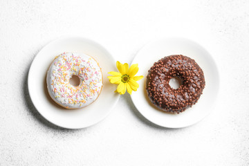 Donuts in chocolate and icing. International Women's Day