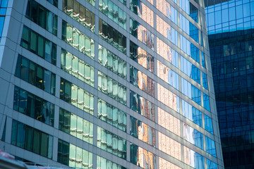 Moscow-City Mirrored skyscrapers business center. Over blue sky background.