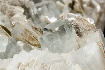 Macro mineral stone Aquamarine in rock on a black background
