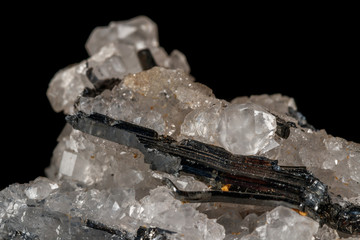 Macro mineral stone Stibnite quartz on a black background