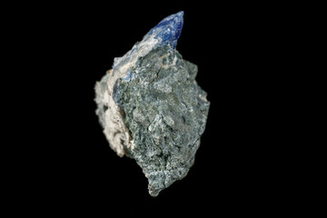 Macro mineral stone Bentorite on a black background