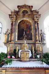 Fototapeta na wymiar Altar of Our Lady of the Rosary in church of St. Clement in Primisweiler, Germany 