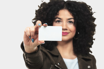 young woman holding a credit card