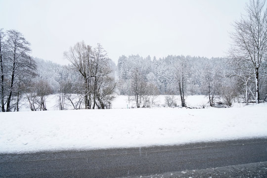 Winter landscape pictures with a lot of snow in cloudy weather in Germany Bavaria included 