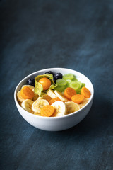 yogurt with fruits, grapes, physalis, bananas and blueberries