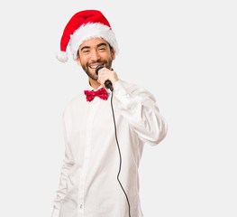 Young man wearing a santa claus hat on Christmas day