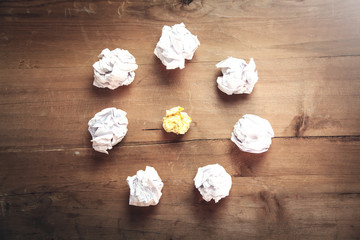 Crumpled papers on wooden background. Idea