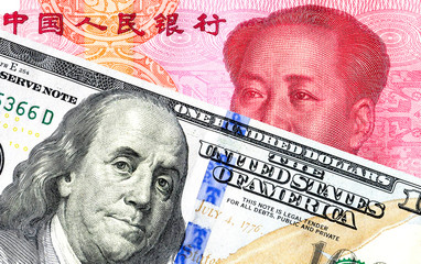 Chinese yuan banknote and american dollar