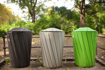 Trash cans for separate recycling garbage in public park. Ecology, recycling, protection of nature...