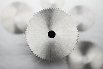 Obraz premium Disk circular saw on gray steel background