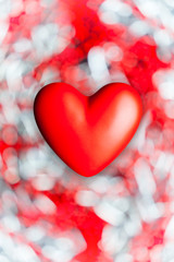 Red heart on abstract bokeh background