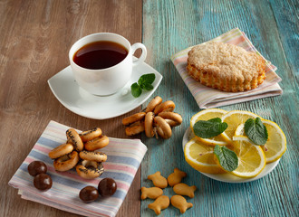 tea, bagels, candies, cookies lemons, puff pastry, mint, mint tea, black tea
