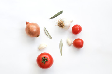 Tomatoes garlic and onion isolated on white background. Top view.