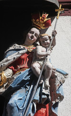 Fototapeta premium Madonna with child Jesus, Statue on the main street of Miltenberg in Lower Franconia, Bavaria, Germany