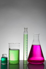 Liquid in laboratory bottles. Scientific biochemical laboratory. Colorful liquid.