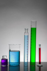 Liquid in laboratory bottles. Scientific biochemical laboratory. Colorful liquid.