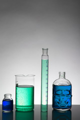 Liquid in laboratory bottles. Scientific biochemical laboratory. Colorful liquid.