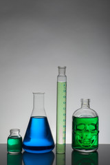 Liquid in laboratory bottles. Scientific biochemical laboratory. Colorful liquid.
