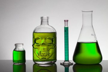 Liquid in laboratory bottles. Scientific biochemical laboratory. Colorful liquid.
