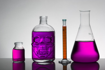 Liquid in laboratory bottles. Scientific biochemical laboratory. Colorful liquid.